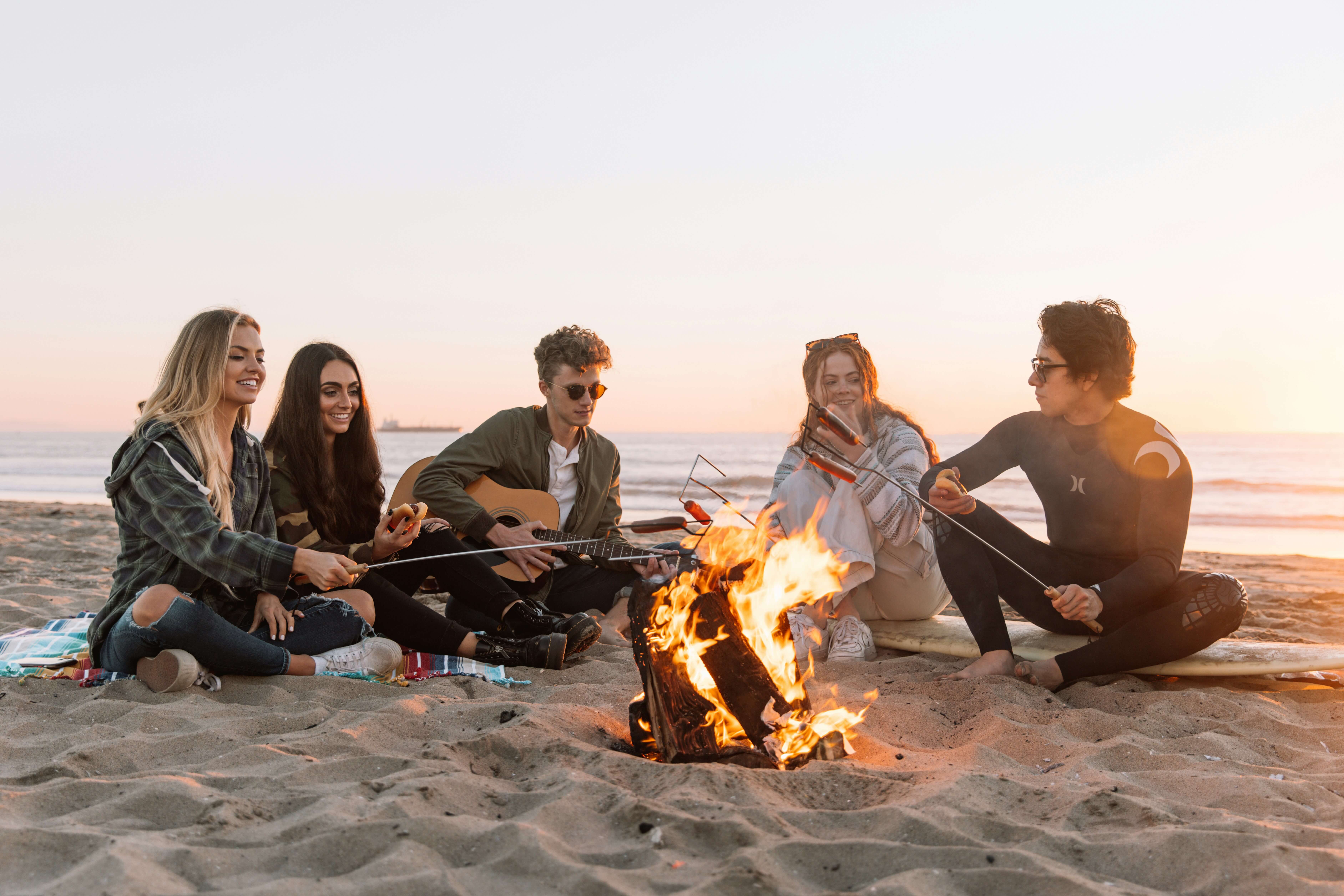 Friends at beach bonfire